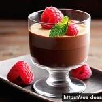 초콜릿 디저트 - A close-up image of an elegant chocolate mousse served in a delicate glass cup, showcasing its airy ...